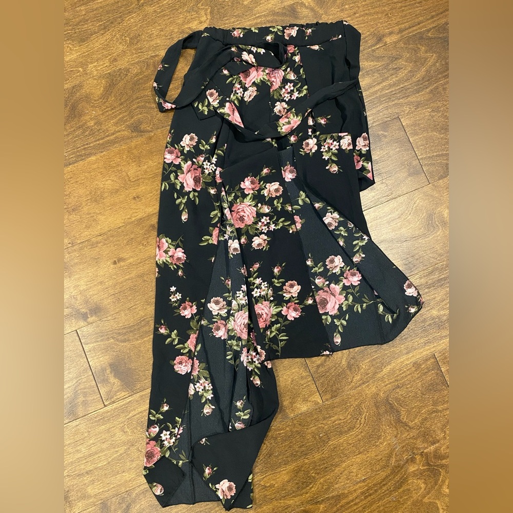 Floral flare leg pants with a slit opening on the bottoms of both legs